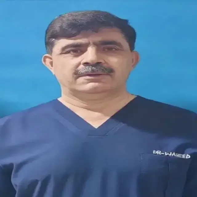 Prof. Dr. Waheed Ullah Khan in navy scrubs.
